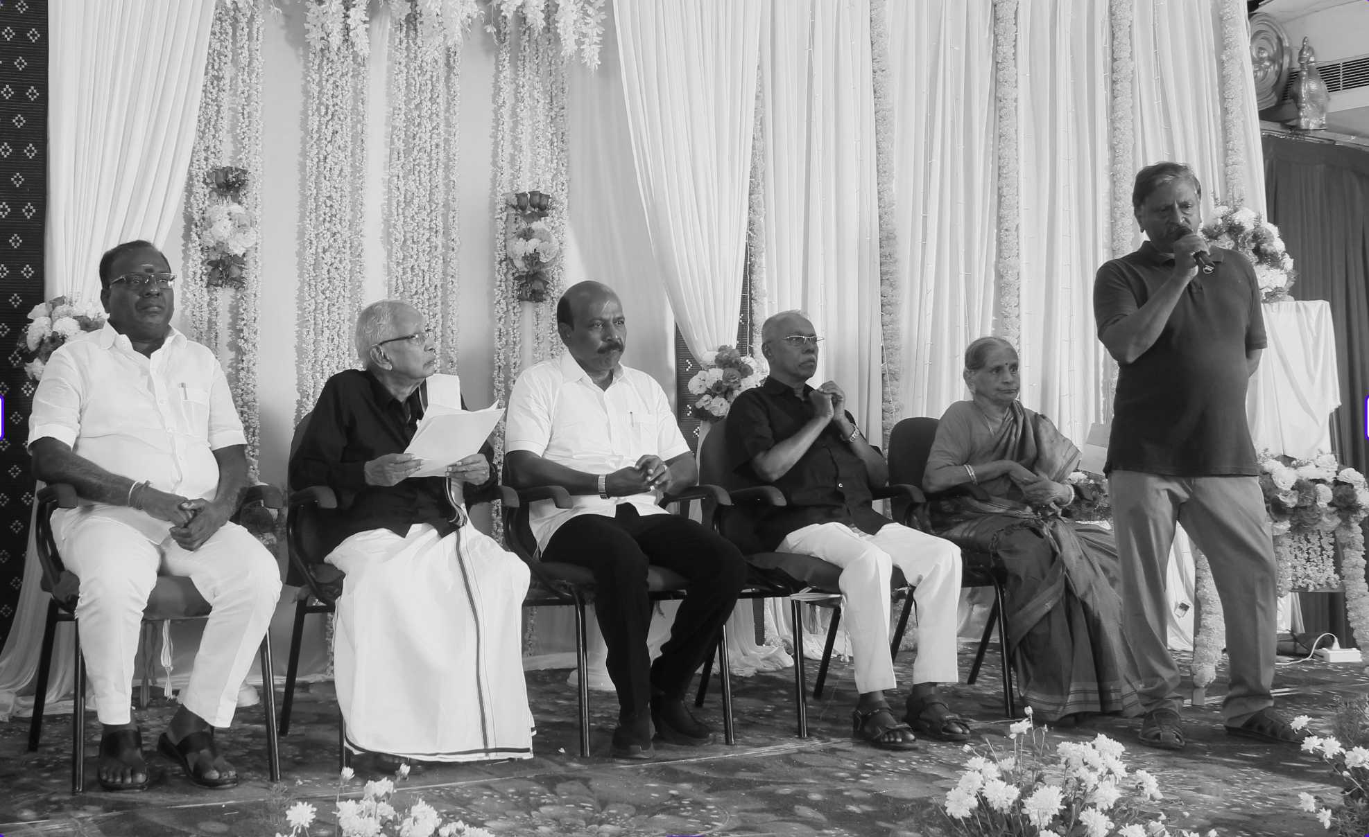 Arul giving a speech about his father